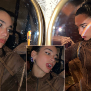 Dua Lipa in the mirror selfies, she playfully stuck out her tongue before flashing her midriff in a brown top which rose up as she sprawled out on the floor. Dua Lipa in the mirror selfies, she playfully stuck out her tongue before flashing her midriff in a brown top which rose up as she sprawled out on the floor.
