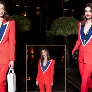 Taylor Hill in a red suit exits the Bulgari H๏τel during fashion week in Paris Taylor Hill in a red suit exits the Bulgari H๏τel during fashion week in Paris