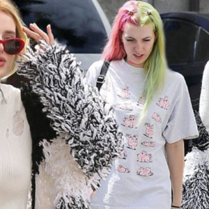 Bella thew a shaggy monochrome striped cardigan over her outfit and opted for a pair of girly