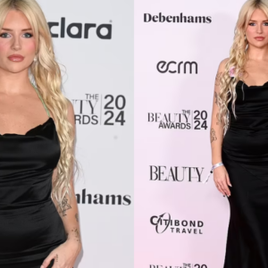 Lottie Moss looks glamorous in a sleeveless black silk dress as she makes a red carpet appearance at the 2024 Beauty Awards