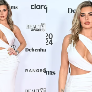 Megan Barton Hanson puts on a very busty display in a white panel cut dress as she graces the red carpet for the 2024 Beauty Awards