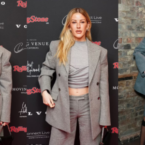 Ellie Goulding displays impressive abs in tailored suit shorts while Jade Thirlwall wows in pink lace-up corset as they lead the stars at the Rolling Stone UK Awards