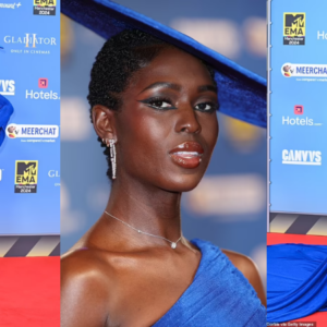 Jodie Turner-Smith puts on a show-stopping display in royal blue gown with a dramatic train and fascinator at the 2024 MTV EMAs