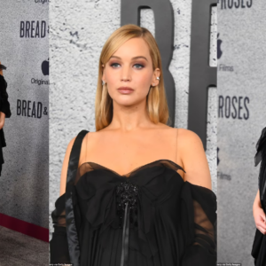 Pregnant Jennifer Lawrence cradles baby bump in goth glam dress at LA premiere of Bread & Roses